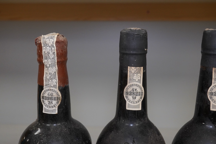 Five bottles of port to include three bottles of Warre’s 1975 (no label), a bottle of C. Da Silvas Vintage 1982 port and a 37.5cl bottle of Warres 1987 Quinta Da Cavadinha. Condition - fair to good, three bottles without